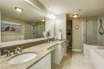 Primary ensuite offers dual sinks, garden tub and glass walk-in shower. 